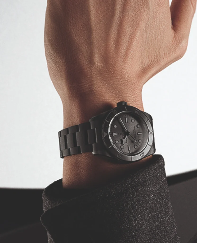 Man wearing a black Tudor watch on his wrist - Lucerne Watches